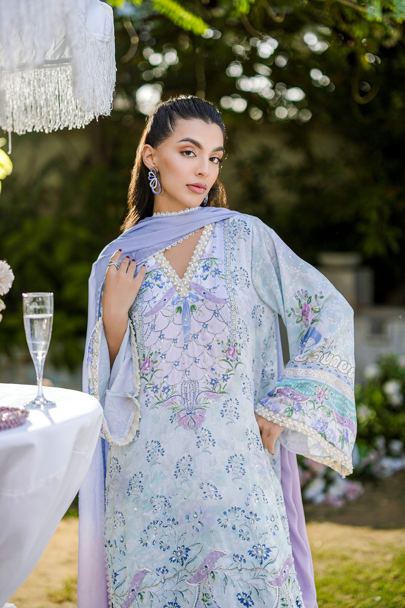 Sky blue 2-piece silk suit with sophisticated hand detailing.