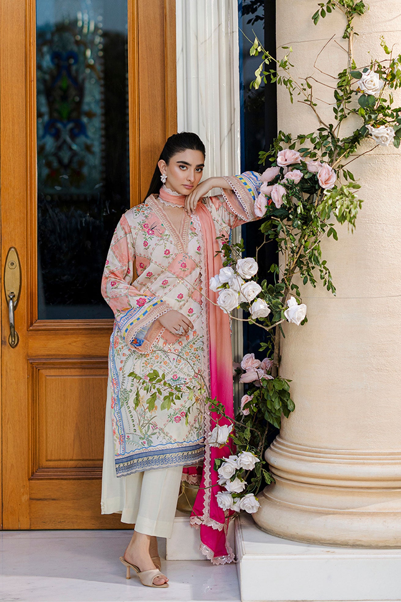 Ethereal orange silk creation with dainty floral embroidery across a checkered motif layout.