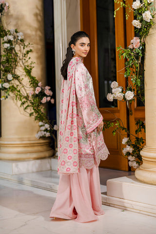 Feminine pink 2-piece silk tunic featuring blooming floral accents and matching flared solid trousers.