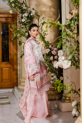 Feminine pink 2-piece silk tunic featuring blooming floral accents and matching flared solid trousers.